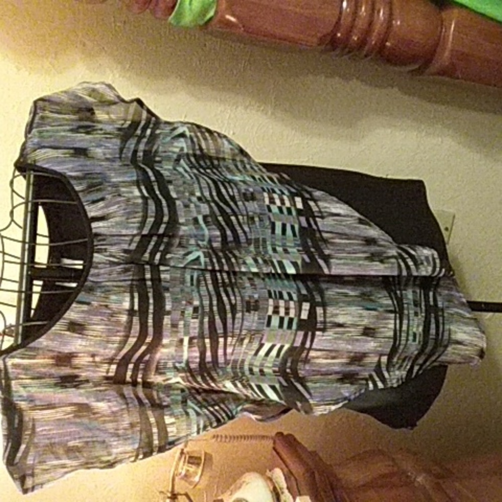 Light shirt. Completely lined. Odd shaped top covering